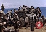 Image of American soldiers search a Japanese youth in uniform Saipan Northern Mariana Islands, 1944, second 39 stock footage video 65675050873