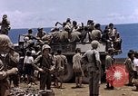 Image of American soldiers search a Japanese youth in uniform Saipan Northern Mariana Islands, 1944, second 42 stock footage video 65675050873