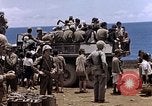 Image of American soldiers search a Japanese youth in uniform Saipan Northern Mariana Islands, 1944, second 43 stock footage video 65675050873