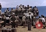 Image of American soldiers search a Japanese youth in uniform Saipan Northern Mariana Islands, 1944, second 44 stock footage video 65675050873