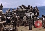 Image of American soldiers search a Japanese youth in uniform Saipan Northern Mariana Islands, 1944, second 45 stock footage video 65675050873