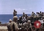Image of American soldiers search a Japanese youth in uniform Saipan Northern Mariana Islands, 1944, second 46 stock footage video 65675050873