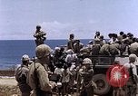 Image of American soldiers search a Japanese youth in uniform Saipan Northern Mariana Islands, 1944, second 47 stock footage video 65675050873