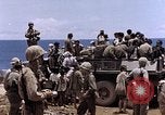 Image of American soldiers search a Japanese youth in uniform Saipan Northern Mariana Islands, 1944, second 48 stock footage video 65675050873