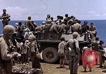 Image of American soldiers search a Japanese youth in uniform Saipan Northern Mariana Islands, 1944, second 49 stock footage video 65675050873