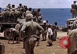 Image of American soldiers search a Japanese youth in uniform Saipan Northern Mariana Islands, 1944, second 51 stock footage video 65675050873