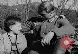 Image of German soldiers greeted by Austrians during Anschluss Austria, 1938, second 16 stock footage video 65675050939