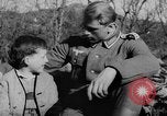 Image of German soldiers greeted by Austrians during Anschluss Austria, 1938, second 18 stock footage video 65675050939