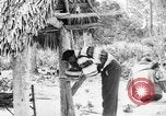 Immagine di Seminole nativi indiani americani cucinare il cibo Florida United States USA, 1919, secondo 48 filmato di repertorio 65675050982