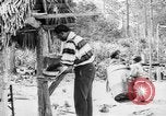 Immagine di Seminole nativi indiani americani cucinare il cibo Florida United States USA, 1919, secondo 53 filmato di repertorio 65675050982