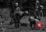 Standbild United States 87th Chemical Mortar Bataillon Carentan Frankreich, 1944, aus Sekunde 54 historischem Filmmaterial Videoclip 65675051322