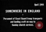 Image of United States Coast Guard personnel march in formation to Sunday service at a church England United Kingdom, 1944, second 1 stock footage video 65675051454