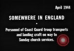 Image of United States Coast Guard personnel march in formation to Sunday service at a church England United Kingdom, 1944, second 3 stock footage video 65675051454