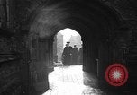 Image of United States Coast Guard personnel march in formation to Sunday service at a church England United Kingdom, 1944, second 30 stock footage video 65675051454