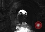 Image of United States Coast Guard personnel march in formation to Sunday service at a church England United Kingdom, 1944, second 33 stock footage video 65675051454