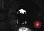 Image of United States Coast Guard personnel march in formation to Sunday service at a church England United Kingdom, 1944, second 34 stock footage video 65675051454
