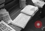 Image of Newspaper headlines tell of Allied invasion New York City USA, 1944, second 6 stock footage video 65675051457