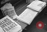 Image of Newspaper headlines tell of Allied invasion New York City USA, 1944, second 8 stock footage video 65675051457