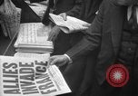 Image of Newspaper headlines tell of Allied invasion New York City USA, 1944, second 22 stock footage video 65675051457