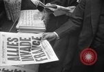 Image of Newspaper headlines tell of Allied invasion New York City USA, 1944, second 23 stock footage video 65675051457