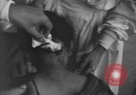 Image of Okinawa civilian wounded receive treatment  Okinawa Ryukyu Islands, 1945, second 4 stock footage video 65675051481
