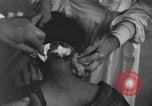 Image of Okinawa civilian wounded receive treatment  Okinawa Ryukyu Islands, 1945, second 5 stock footage video 65675051481