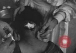 Image of Okinawa civilian wounded receive treatment  Okinawa Ryukyu Islands, 1945, second 6 stock footage video 65675051481