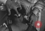 Image of Okinawa civilian wounded receive treatment  Okinawa Ryukyu Islands, 1945, second 7 stock footage video 65675051481
