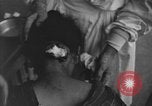 Image of Okinawa civilian wounded receive treatment  Okinawa Ryukyu Islands, 1945, second 9 stock footage video 65675051481