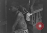 Image of Okinawa civilian wounded receive treatment  Okinawa Ryukyu Islands, 1945, second 38 stock footage video 65675051481