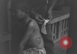 Image of Okinawa civilian wounded receive treatment  Okinawa Ryukyu Islands, 1945, second 39 stock footage video 65675051481