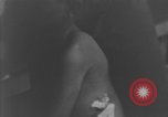 Image of Okinawa civilian wounded receive treatment  Okinawa Ryukyu Islands, 1945, second 40 stock footage video 65675051481