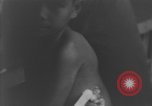 Image of Okinawa civilian wounded receive treatment  Okinawa Ryukyu Islands, 1945, second 41 stock footage video 65675051481