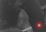 Image of Okinawa civilian wounded receive treatment  Okinawa Ryukyu Islands, 1945, second 45 stock footage video 65675051481