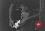 Image of Okinawa civilian wounded receive treatment  Okinawa Ryukyu Islands, 1945, second 48 stock footage video 65675051481