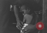 Image of Okinawa civilian wounded receive treatment  Okinawa Ryukyu Islands, 1945, second 51 stock footage video 65675051481