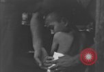 Image of Okinawa civilian wounded receive treatment  Okinawa Ryukyu Islands, 1945, second 52 stock footage video 65675051481