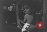 Image of Okinawa civilian wounded receive treatment  Okinawa Ryukyu Islands, 1945, second 53 stock footage video 65675051481