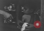 Image of Okinawa civilian wounded receive treatment  Okinawa Ryukyu Islands, 1945, second 55 stock footage video 65675051481