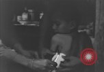 Image of Okinawa civilian wounded receive treatment  Okinawa Ryukyu Islands, 1945, second 57 stock footage video 65675051481