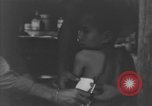 Image of Okinawa civilian wounded receive treatment  Okinawa Ryukyu Islands, 1945, second 58 stock footage video 65675051481