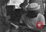 Image of Okinawa civilian wounded receive treatment  Okinawa Ryukyu Islands, 1945, second 60 stock footage video 65675051481