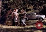 Image of People visiting a forest in their 1939 Ford car United States USA, 1939, second 26 stock footage video 65675051552