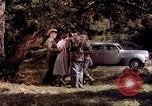 Image of People visiting a forest in their 1939 Ford car United States USA, 1939, second 27 stock footage video 65675051552