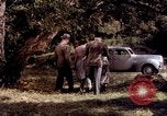 Image of People visiting a forest in their 1939 Ford car United States USA, 1939, second 28 stock footage video 65675051552