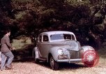 Image of People visiting a forest in their 1939 Ford car United States USA, 1939, second 31 stock footage video 65675051552