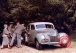 Image of People visiting a forest in their 1939 Ford car United States USA, 1939, second 32 stock footage video 65675051552
