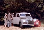 Image of People visiting a forest in their 1939 Ford car United States USA, 1939, second 33 stock footage video 65675051552
