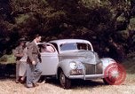 Image of People visiting a forest in their 1939 Ford car United States USA, 1939, second 34 stock footage video 65675051552