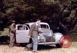 Image of People visiting a forest in their 1939 Ford car United States USA, 1939, second 35 stock footage video 65675051552